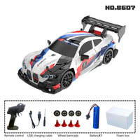 1:24 High-Speed RC Racing Drift Car Set – LED Lights, Rechargeable 3.7V Battery, Spare Tires & Road Cones